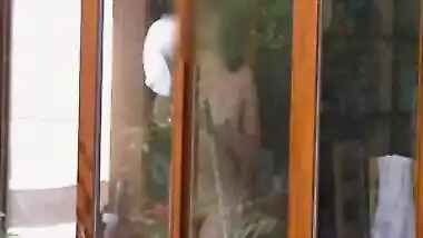 Neighbour cleaning windows.